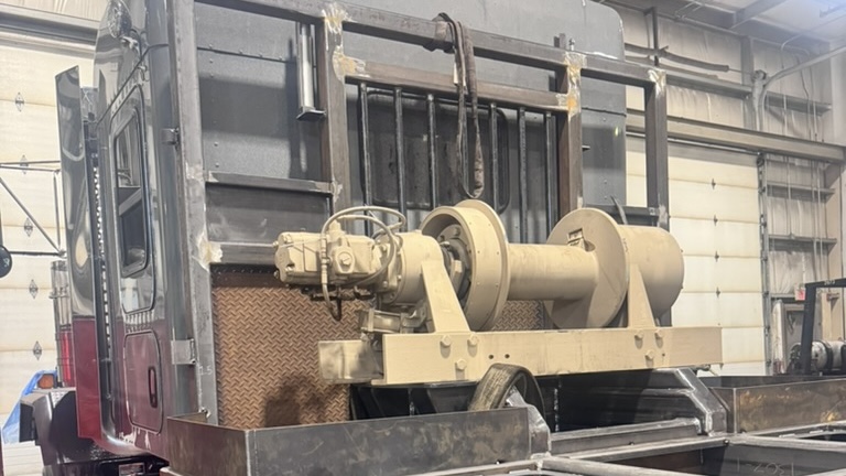 Winch for custom oilfield and heavy haul Kenworth C500 Class 8 truck deck built by Core Fabrication