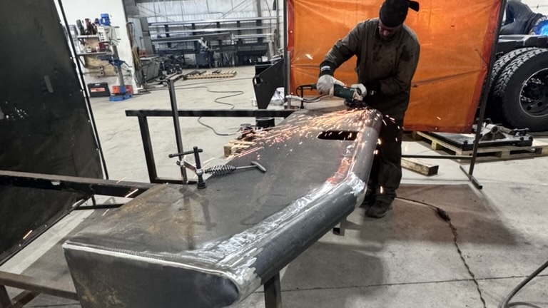 Red Seal journeyman welder working on custom oilfield bumper for Core Fabrication Kenworth C500 deck build